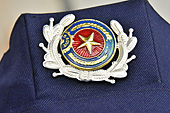Insigne sur la casquette d'un garde - Hô Chi Minh-Ville - Viêtnam